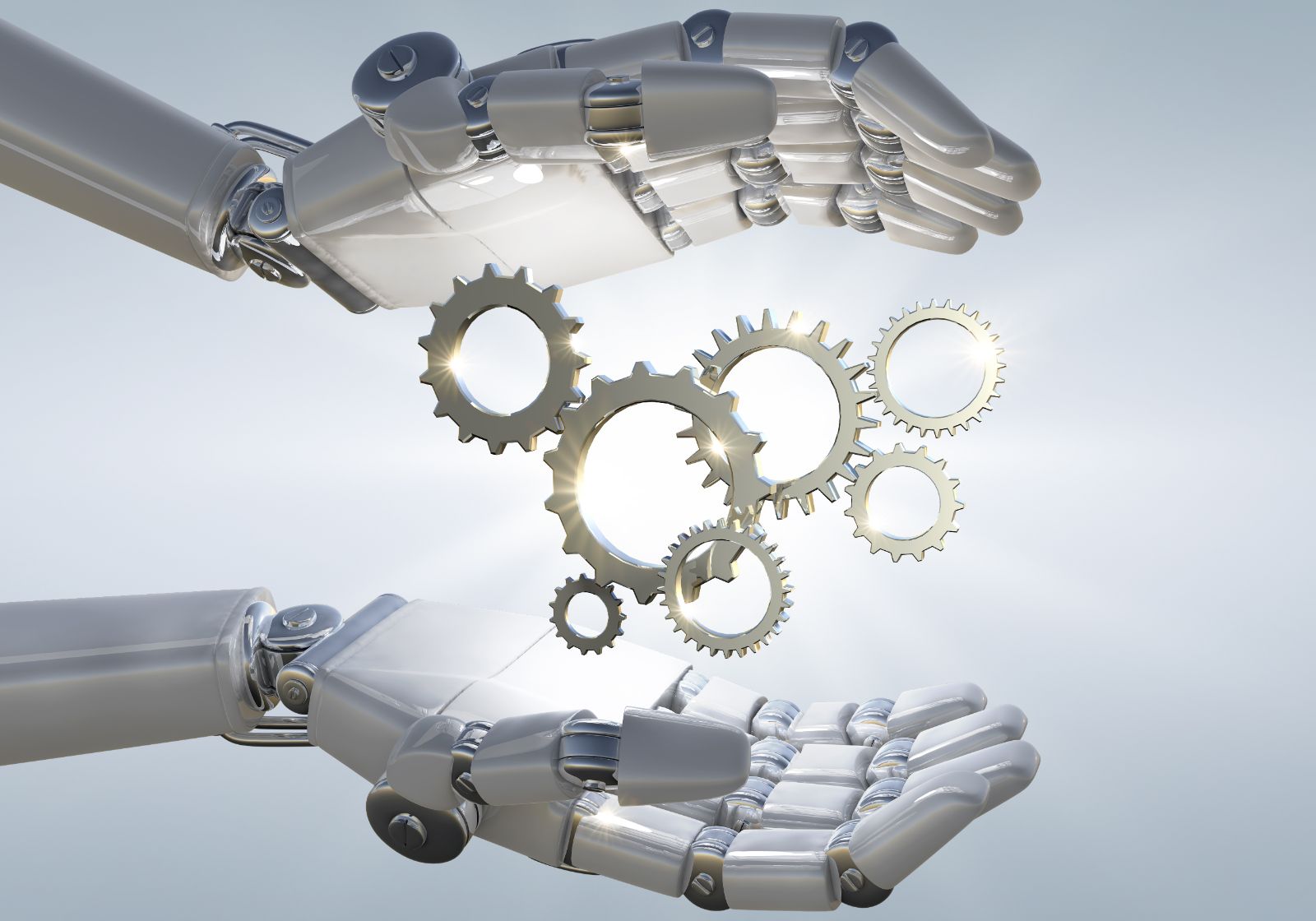 A robotic hand holding a metal gear