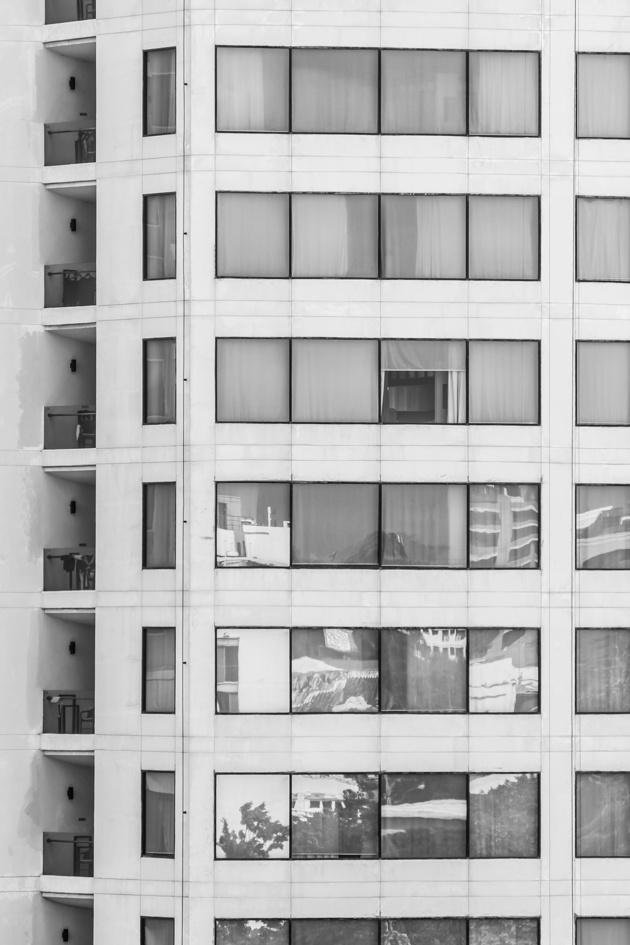 A grid of windows on a residential tower