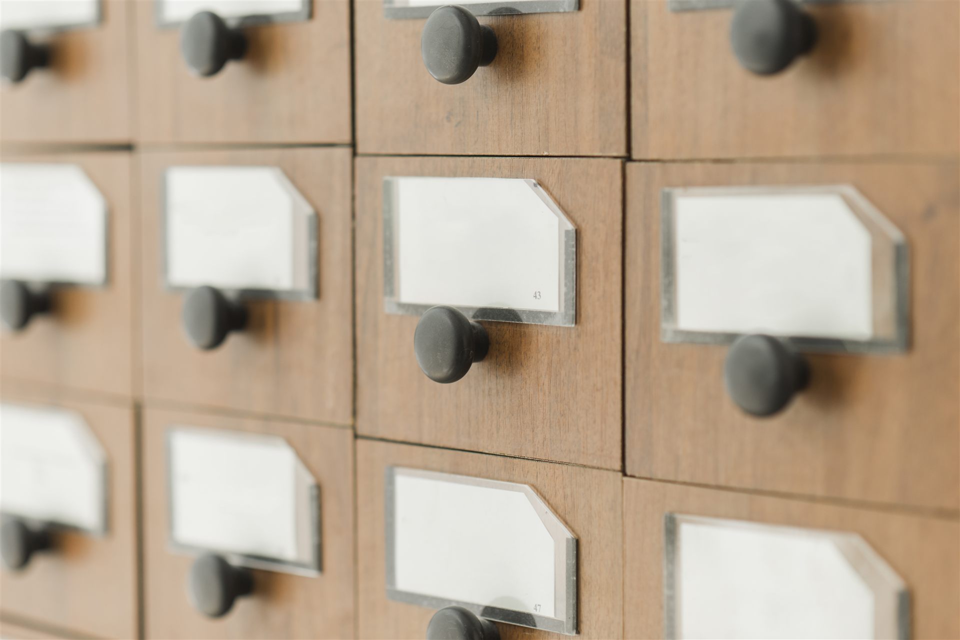 Library catalogue drawers, each with its label