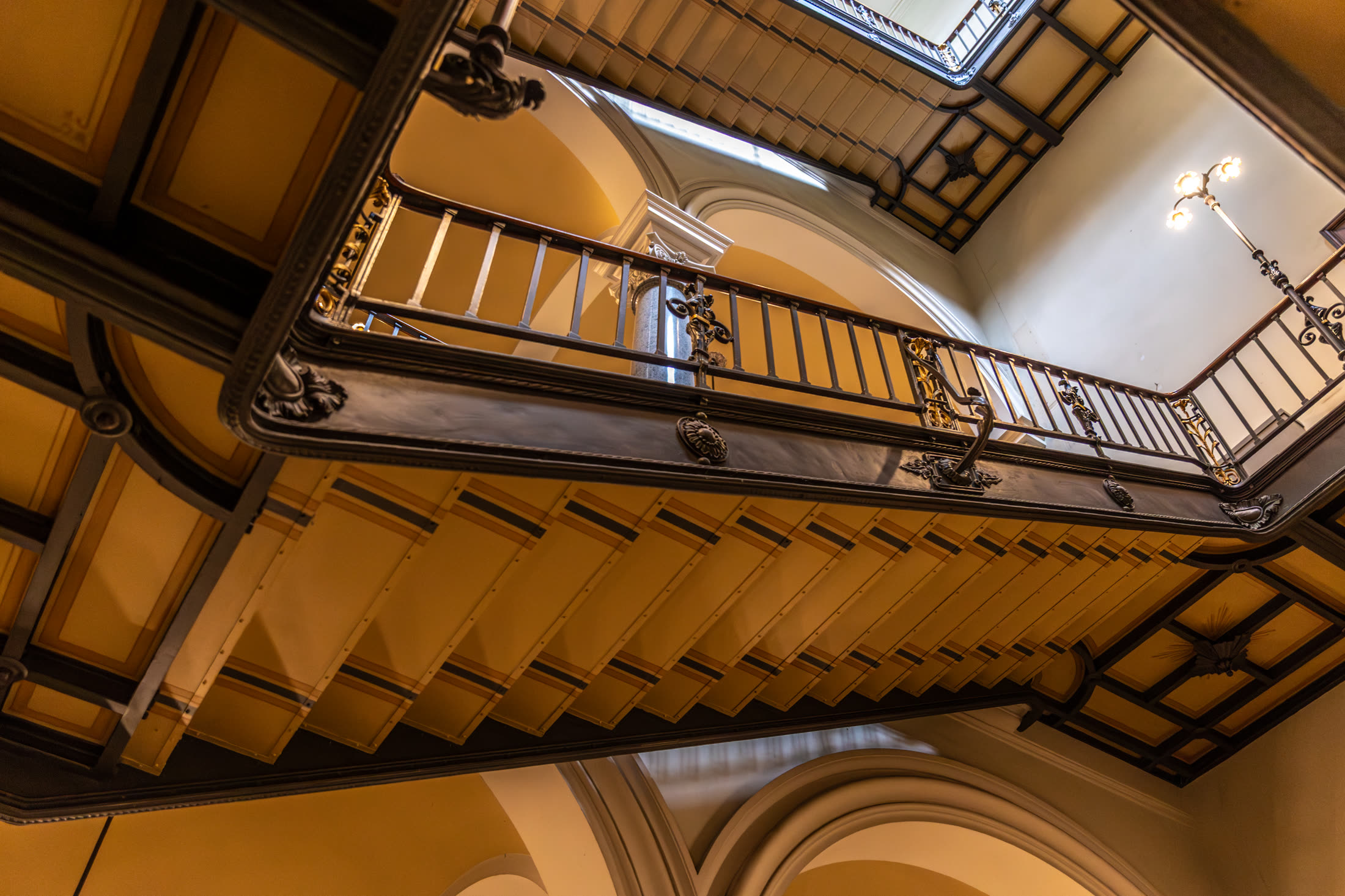 Looking up an elegant spiral staircase