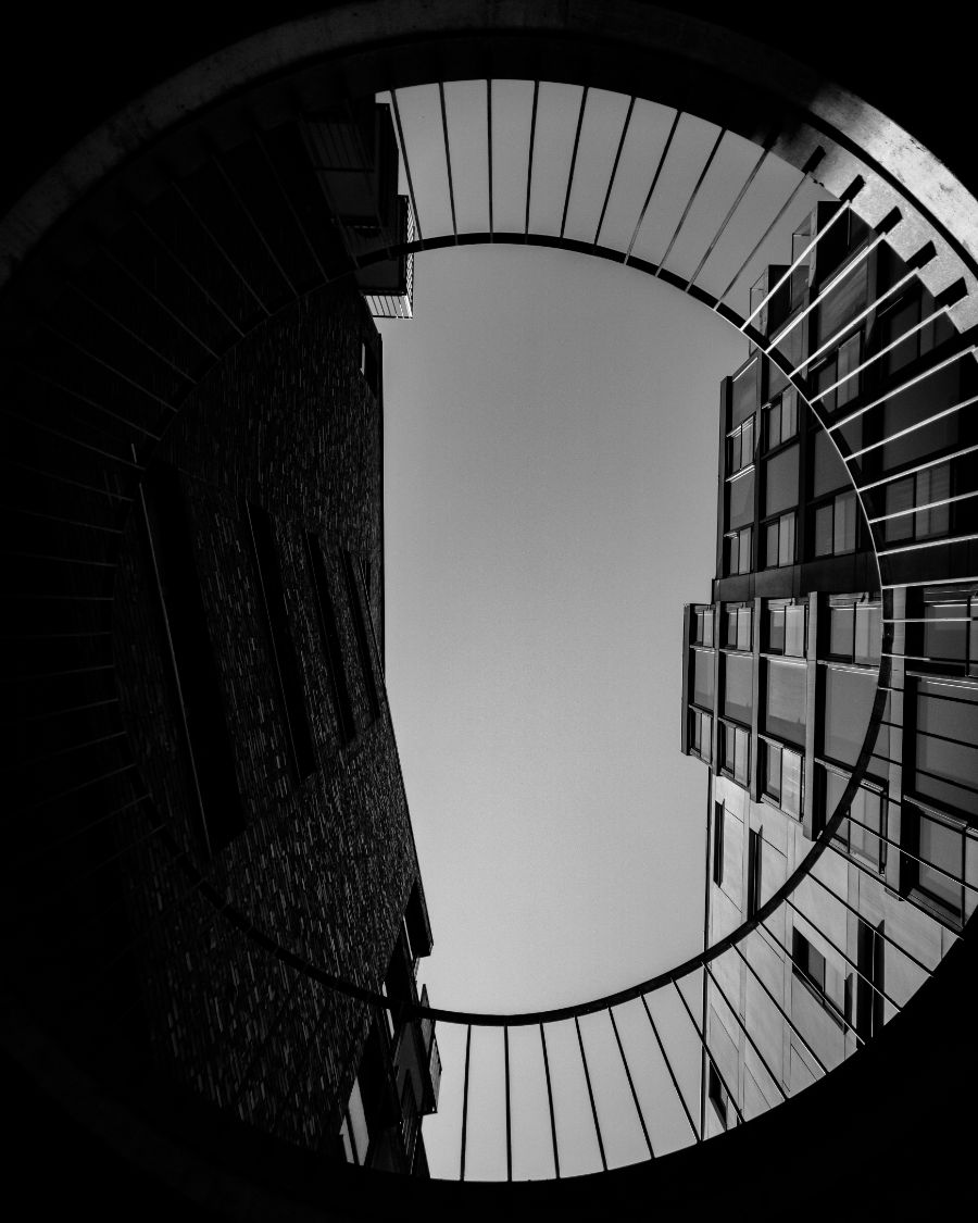 A building facade and balconies seen from directly below