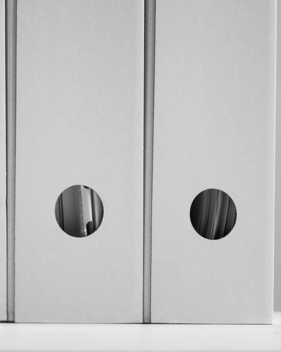 Two white archive box files side by side